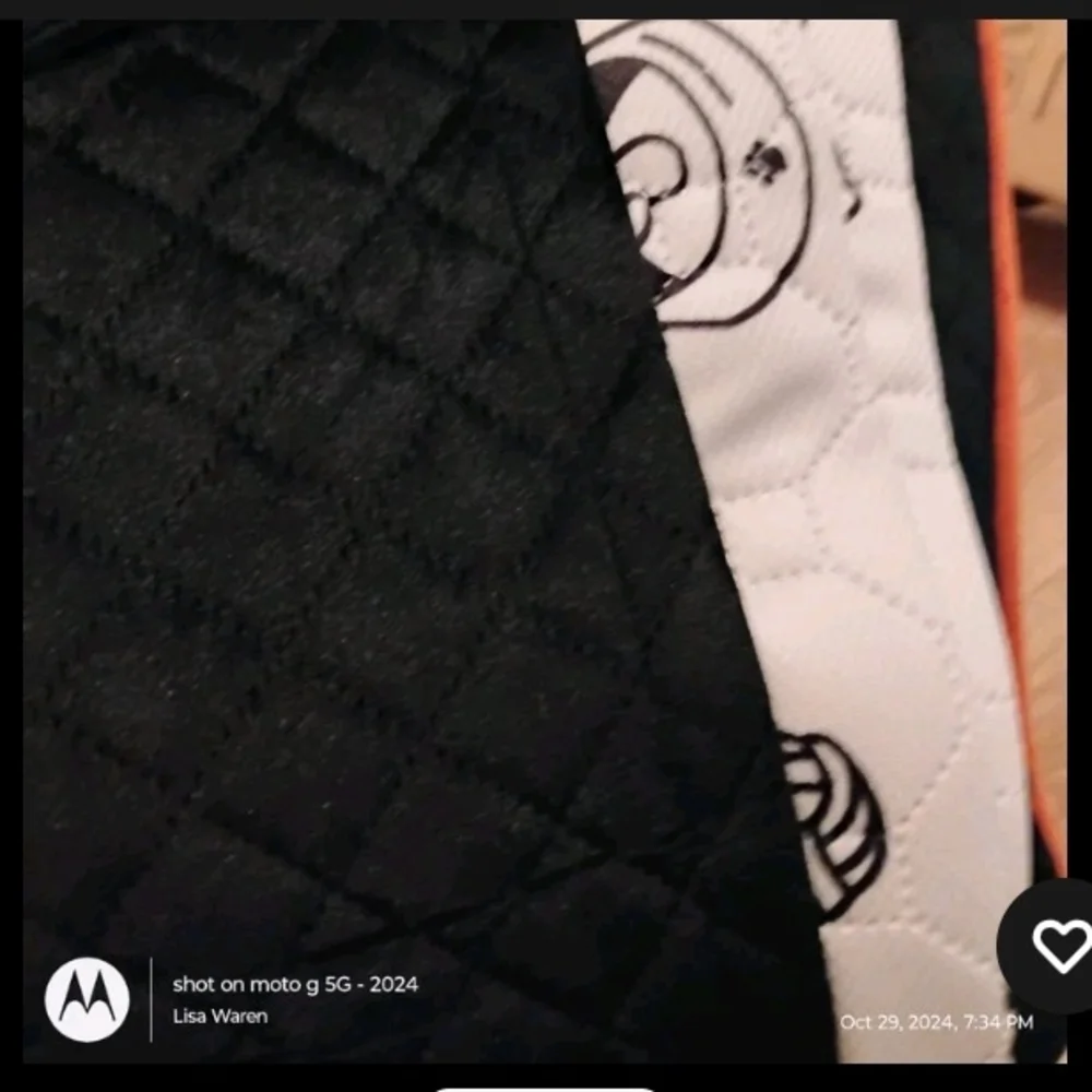 Gray and Black Quilted Car Seat with Orange Trim